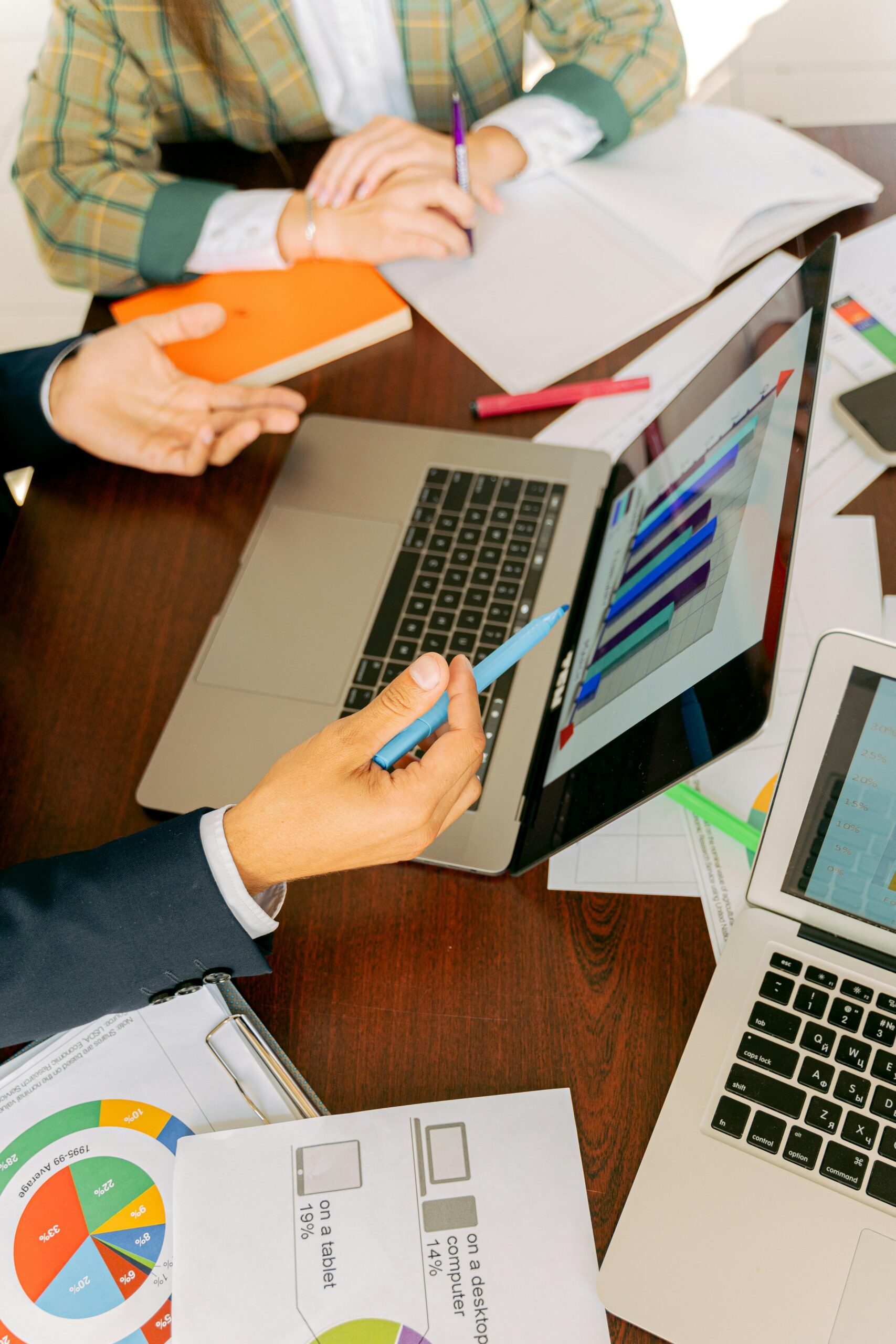 Navigating-the-Challenges-of-Data-Lifecycle-Management-scaled.jpg Free A Person in Black Suit Holding a Pen Stock Photo